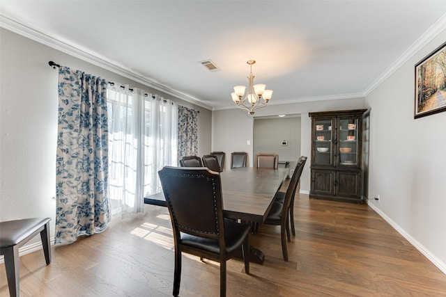 1401 Crescent Dr, Sherman, TX 75092 - dining space featuring a chandelier, ornamental molding, wood finished floors, and baseboards