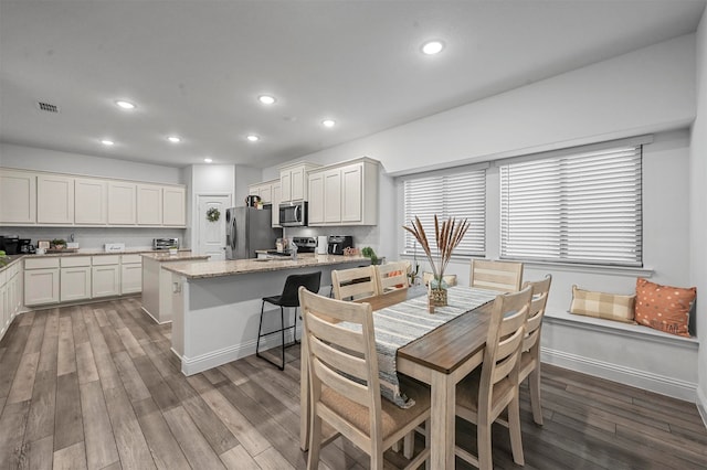 dining room featuring hardwood / wood-style flooring