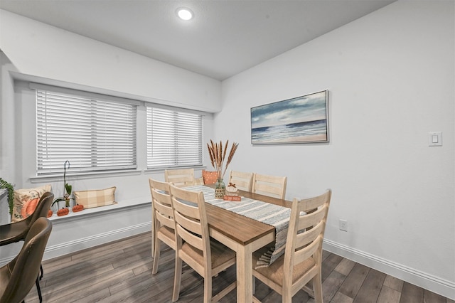 dining space featuring dark hardwood / wood-style floors