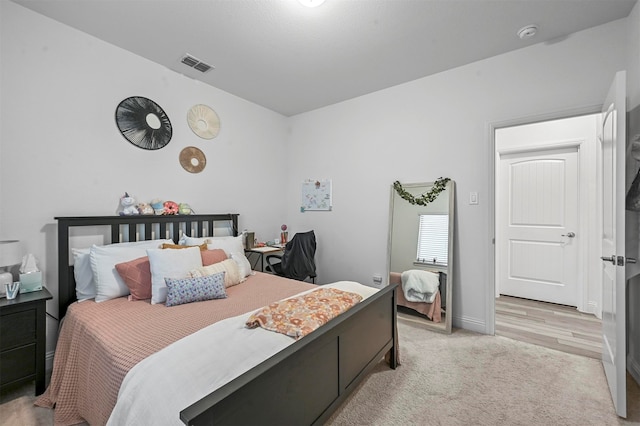 bedroom with light wood-type flooring