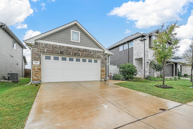 view of front of home with a garage, central AC unit, and a front lawn