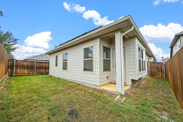 view of property exterior with a yard