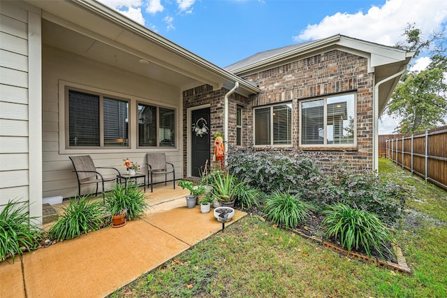 property entrance featuring a patio area