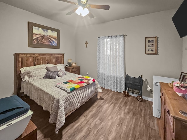 bedroom featuring ceiling fan and wood-type flooring