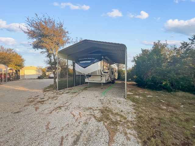 view of vehicle parking with a carport