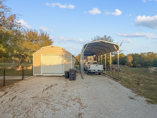 view of car parking featuring a garage and a carport