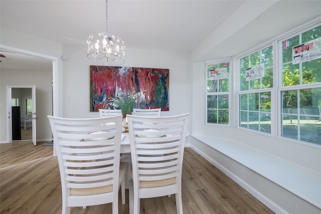 dining space featuring a chandelier and hardwood / wood-style flooring