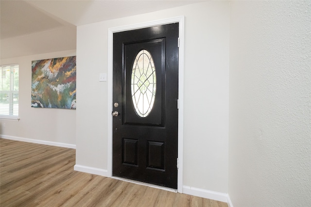 foyer entrance with light hardwood / wood-style floors