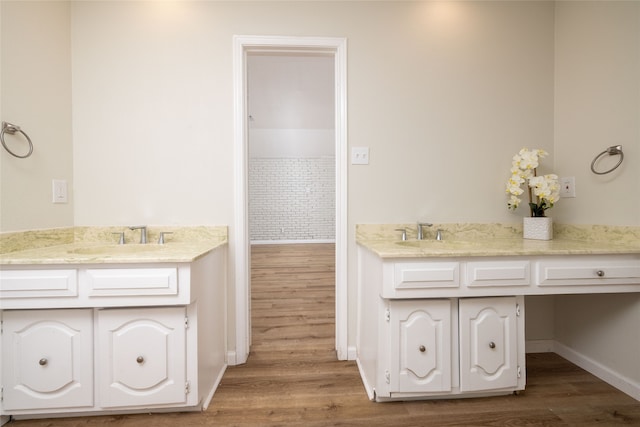 bathroom with vanity and wood-type flooring