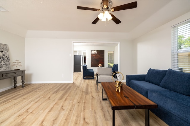 living room featuring light hardwood / wood-style floors and ceiling fan