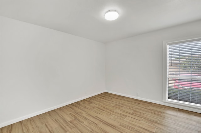 unfurnished room with light hardwood / wood-style floors