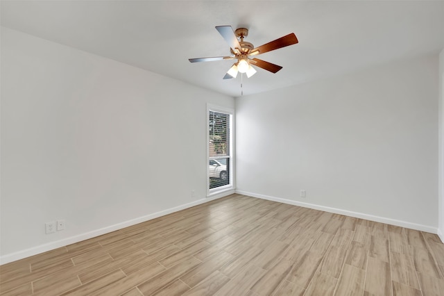 empty room featuring light wood-type flooring and ceiling fan