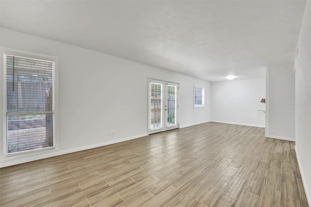 spare room featuring light hardwood / wood-style floors