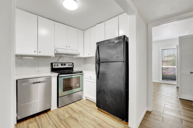 kitchen with white cabinetry, light wood-type flooring, stainless steel appliances, and tasteful backsplash