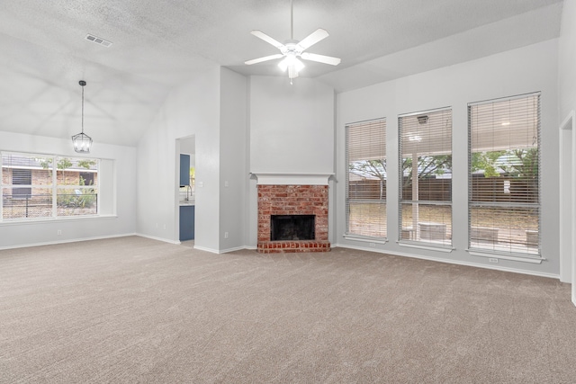 unfurnished living room with a fireplace, a textured ceiling, light carpet, lofted ceiling, and ceiling fan