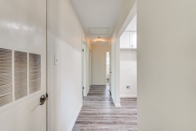 hallway with light wood-type flooring