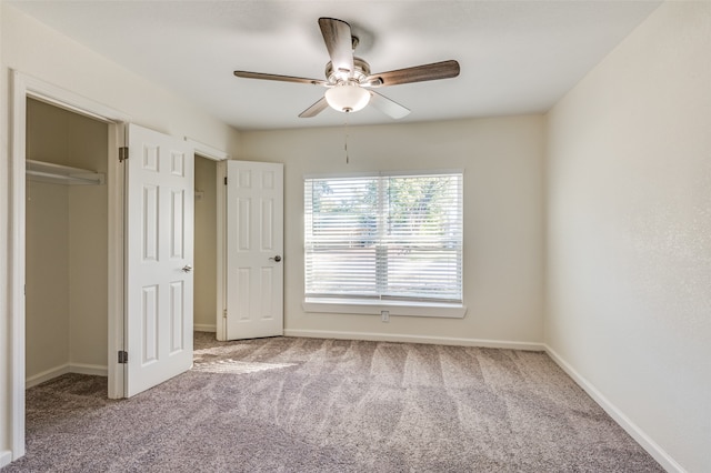 unfurnished bedroom featuring carpet flooring, a closet, and ceiling fan