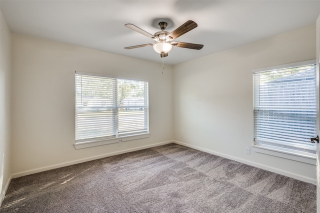 empty room with ceiling fan and carpet