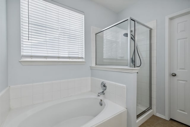 bathroom featuring tile patterned floors and plus walk in shower