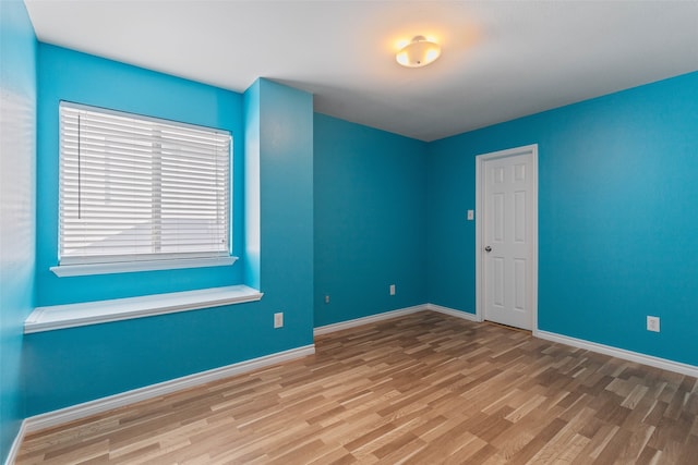 unfurnished room featuring hardwood / wood-style floors