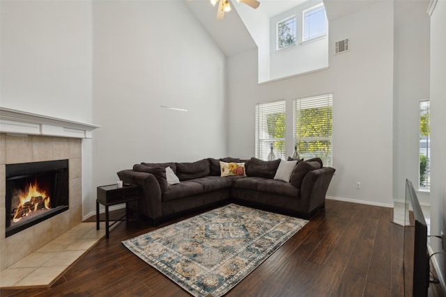 living room featuring high vaulted ceiling, plenty of natural light, and dark hardwood / wood-style floors