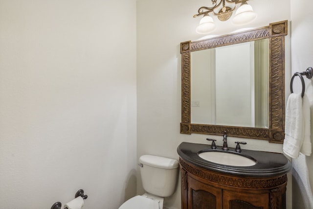 bathroom with toilet and vanity