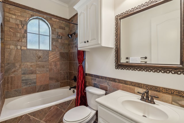 full bathroom with vanity, toilet, crown molding, and tiled shower / bath combo