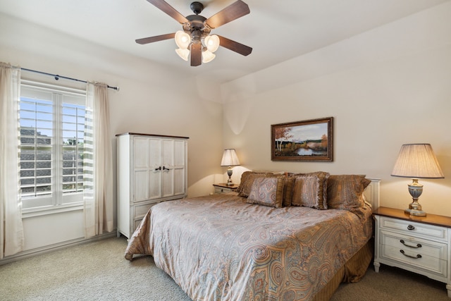 bedroom with light colored carpet and ceiling fan