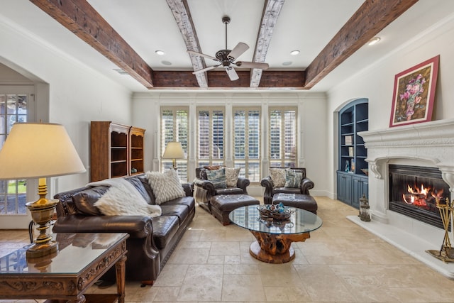 living room with ceiling fan, crown molding, and beam ceiling