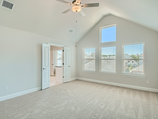 interior space featuring high vaulted ceiling, light colored carpet, and ceiling fan