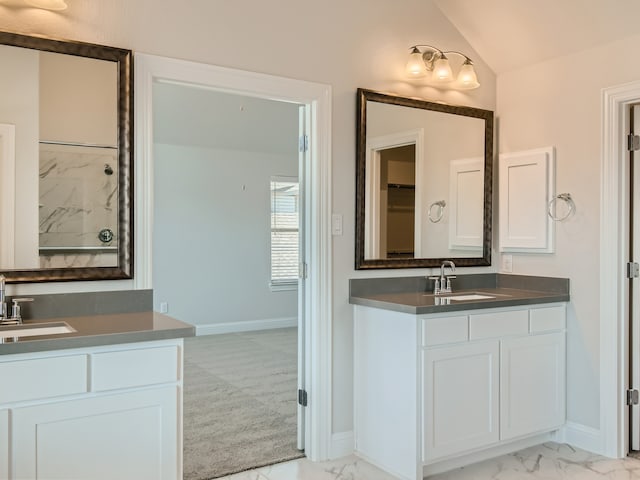 bathroom featuring vanity and vaulted ceiling