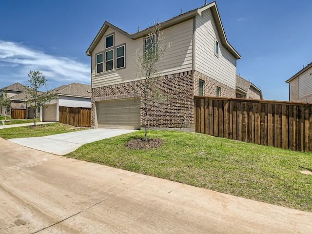 view of front of house with a garage and a front lawn