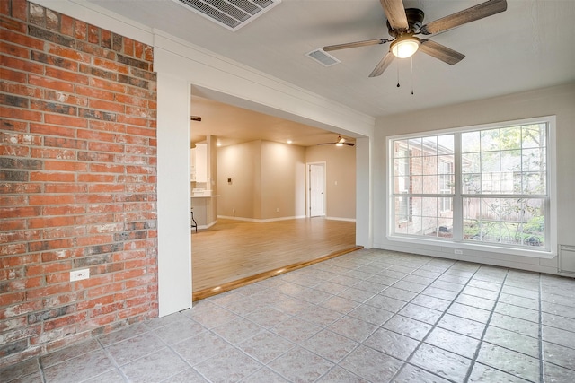 empty room featuring light wood-type flooring and ceiling fan