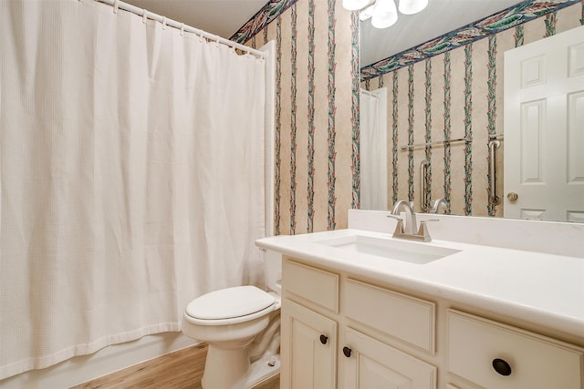 full bathroom featuring toilet, vanity, shower / bath combination with curtain, and hardwood / wood-style flooring