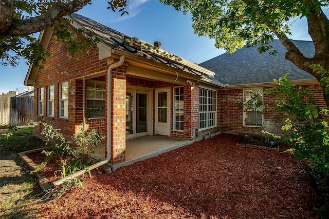 back of property featuring a patio