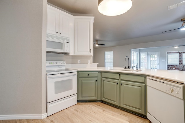 kitchen with sink, ceiling fan, white appliances, white cabinets, and light wood-type flooring