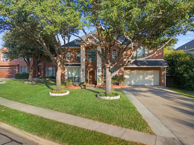 view of front of home with a garage and a front lawn