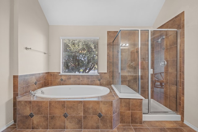 bathroom featuring vaulted ceiling, tile patterned floors, and separate shower and tub