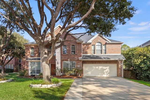 view of front facade with a garage and a front lawn