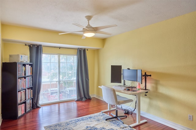 office with ceiling fan, a textured ceiling, and dark hardwood / wood-style floors