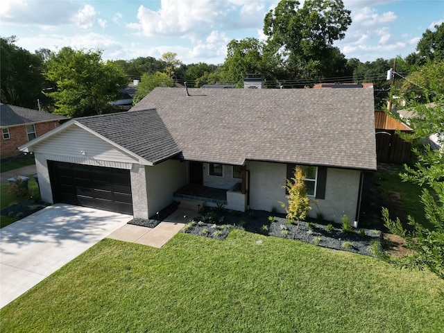 view of front facade with a front lawn and a garage