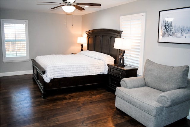 bedroom with ceiling fan and dark hardwood / wood-style floors