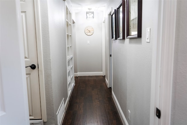 hallway featuring dark hardwood / wood-style flooring