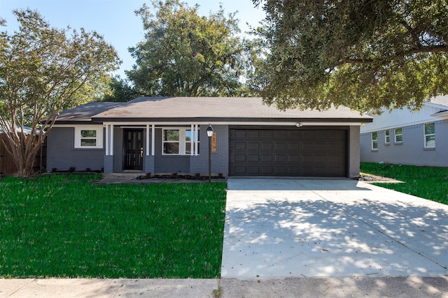 single story home featuring a garage and a front lawn