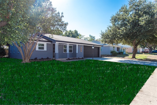 ranch-style home with a garage and a front lawn