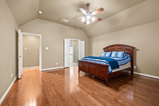 bedroom featuring hardwood / wood-style flooring, ceiling fan, and vaulted ceiling