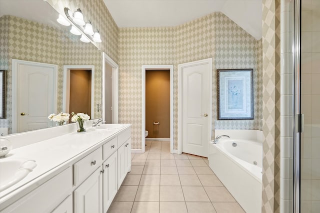 full bathroom featuring separate shower and tub, vanity, vaulted ceiling, tile patterned flooring, and toilet