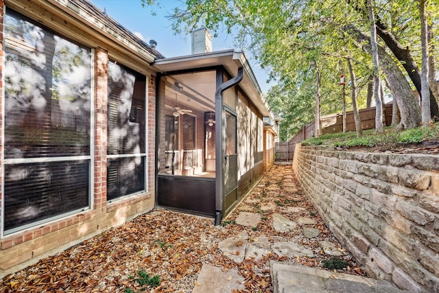 view of side of property featuring a sunroom