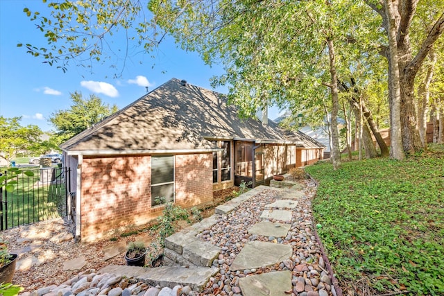 view of home's exterior featuring a sunroom