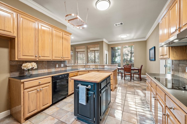 kitchen with butcher block counters, tasteful backsplash, black appliances, and sink